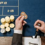 Overhead view of a casino table with poker chips and a tobacco pipe, depicting a gambling scene. — Get the Ultimate Roblox Ga