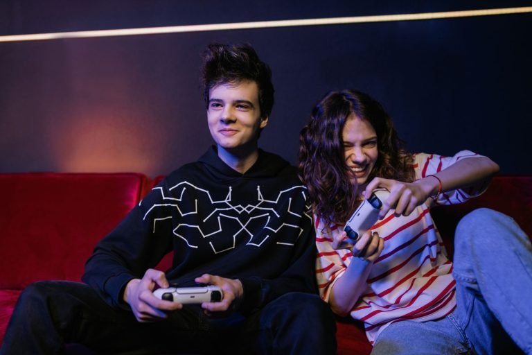 Two teenagers playing video games together, smiling and enjoying the moment indoors. — Maximize Your Gaming with Verified Cob